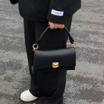 Black baguette bag with underarm design, high-quality niche handbag, trendy crossbody bag.